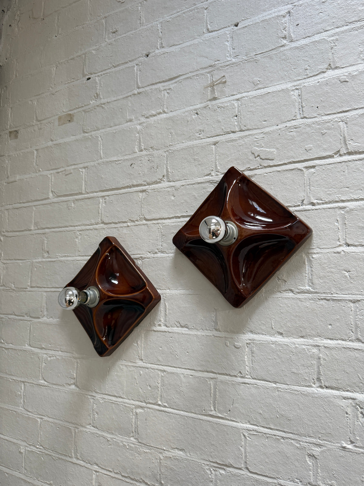 PAIR OF BROWN CERAMIC WALL LIGHTS