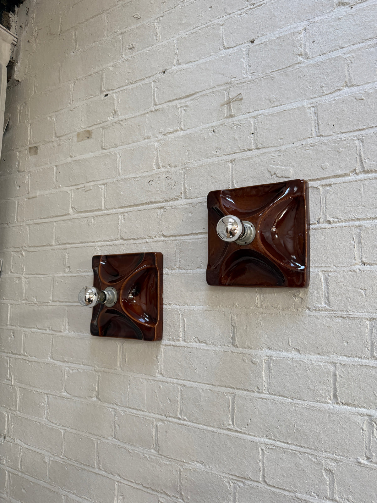 PAIR OF BROWN CERAMIC WALL LIGHTS