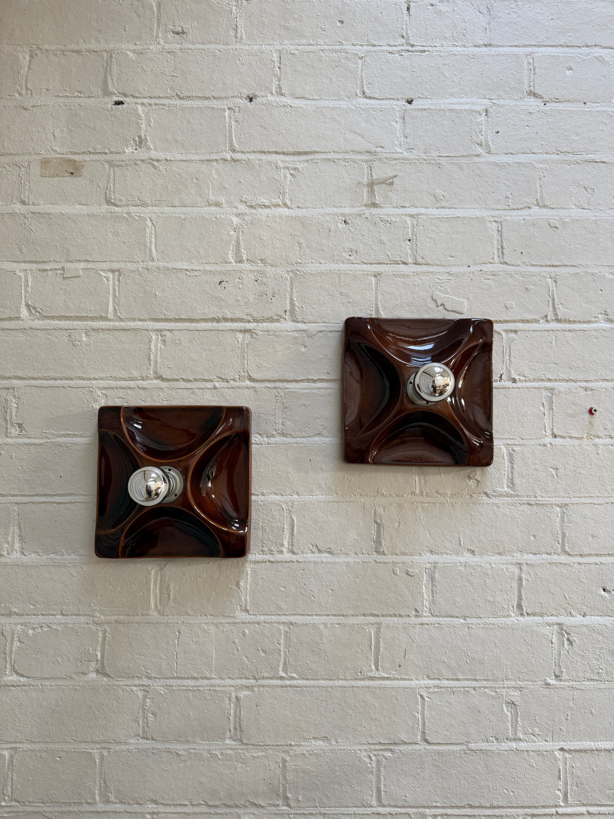 PAIR OF BROWN CERAMIC WALL LIGHTS