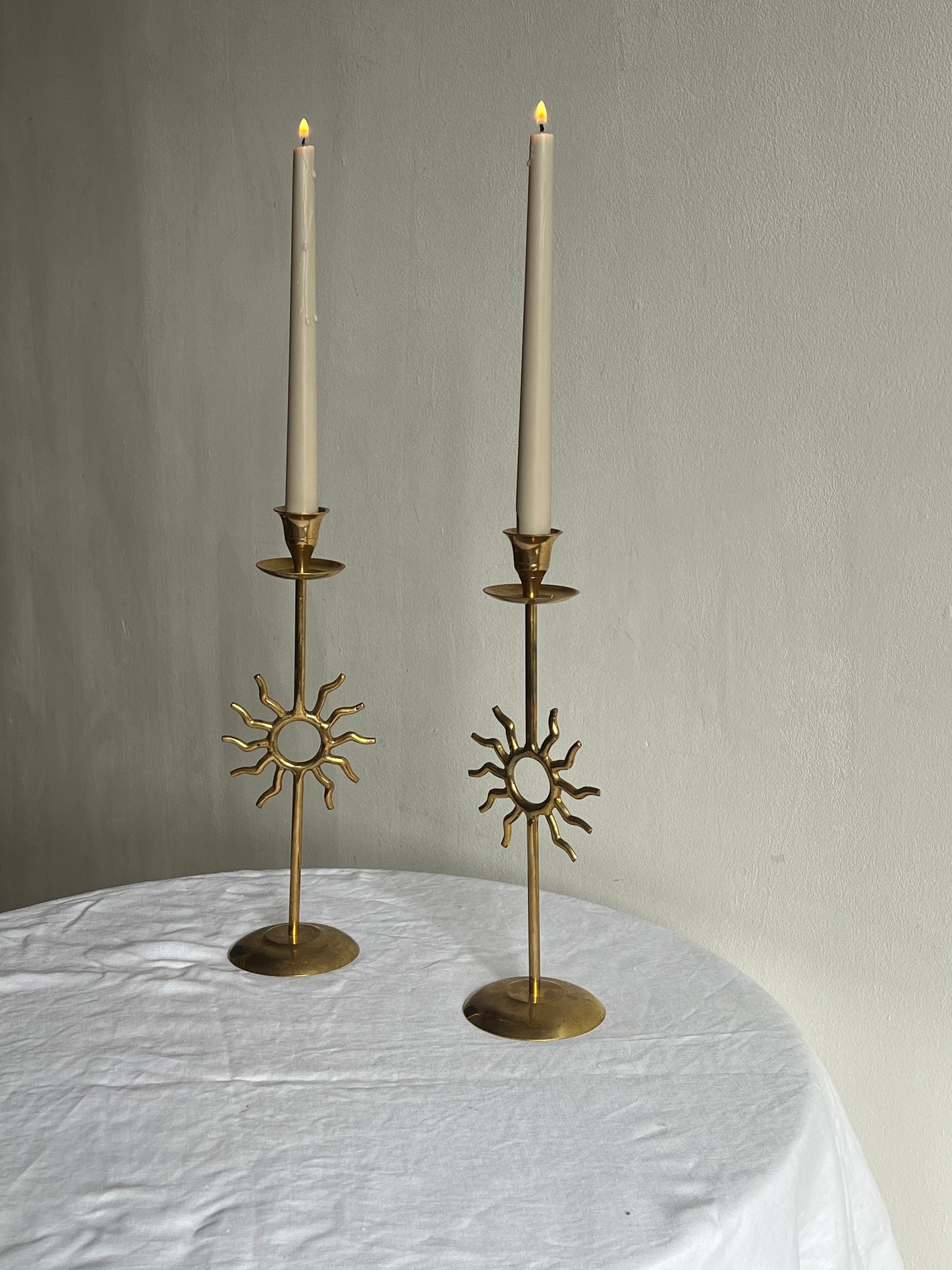 PAIR OF BRASS SUN CANDLE HOLDERS