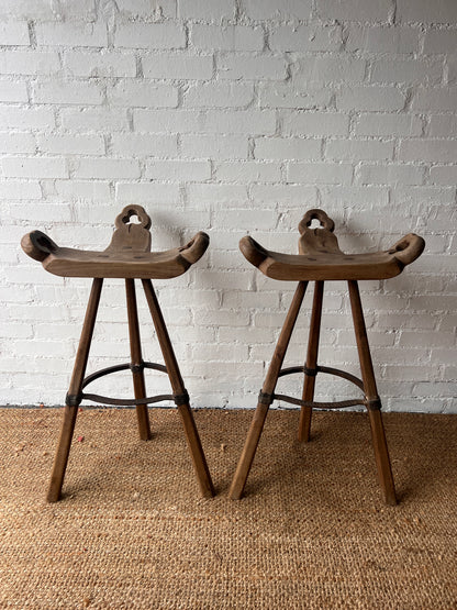 PAIR OF BRUTALIST SADDLE WOODEN STOOLS