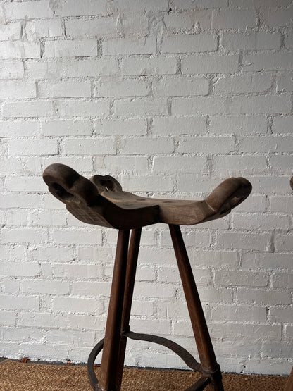 PAIR OF BRUTALIST SADDLE WOODEN STOOLS