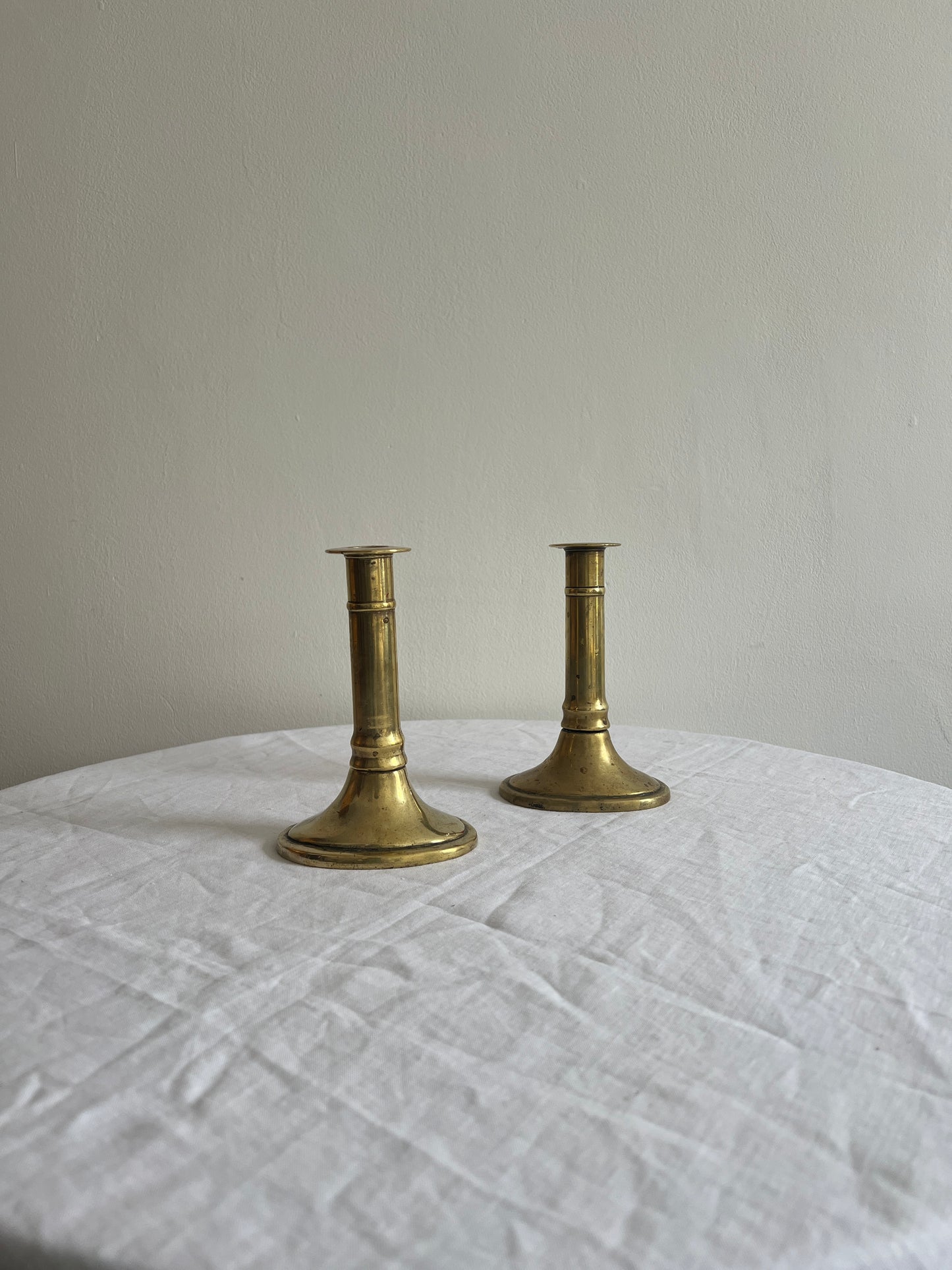 Pair of English polished brass candle sticks
