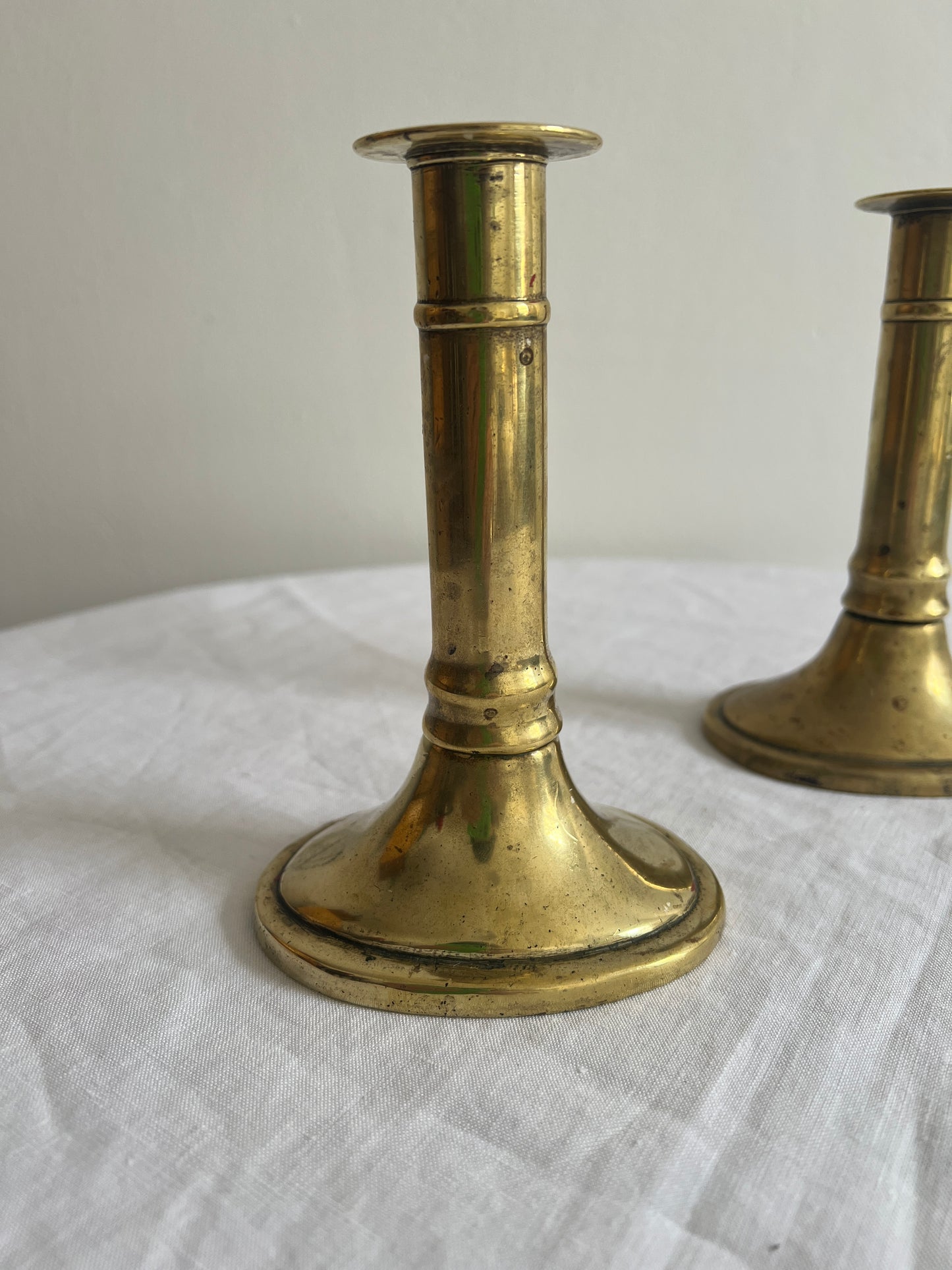 Pair of English polished brass candle sticks