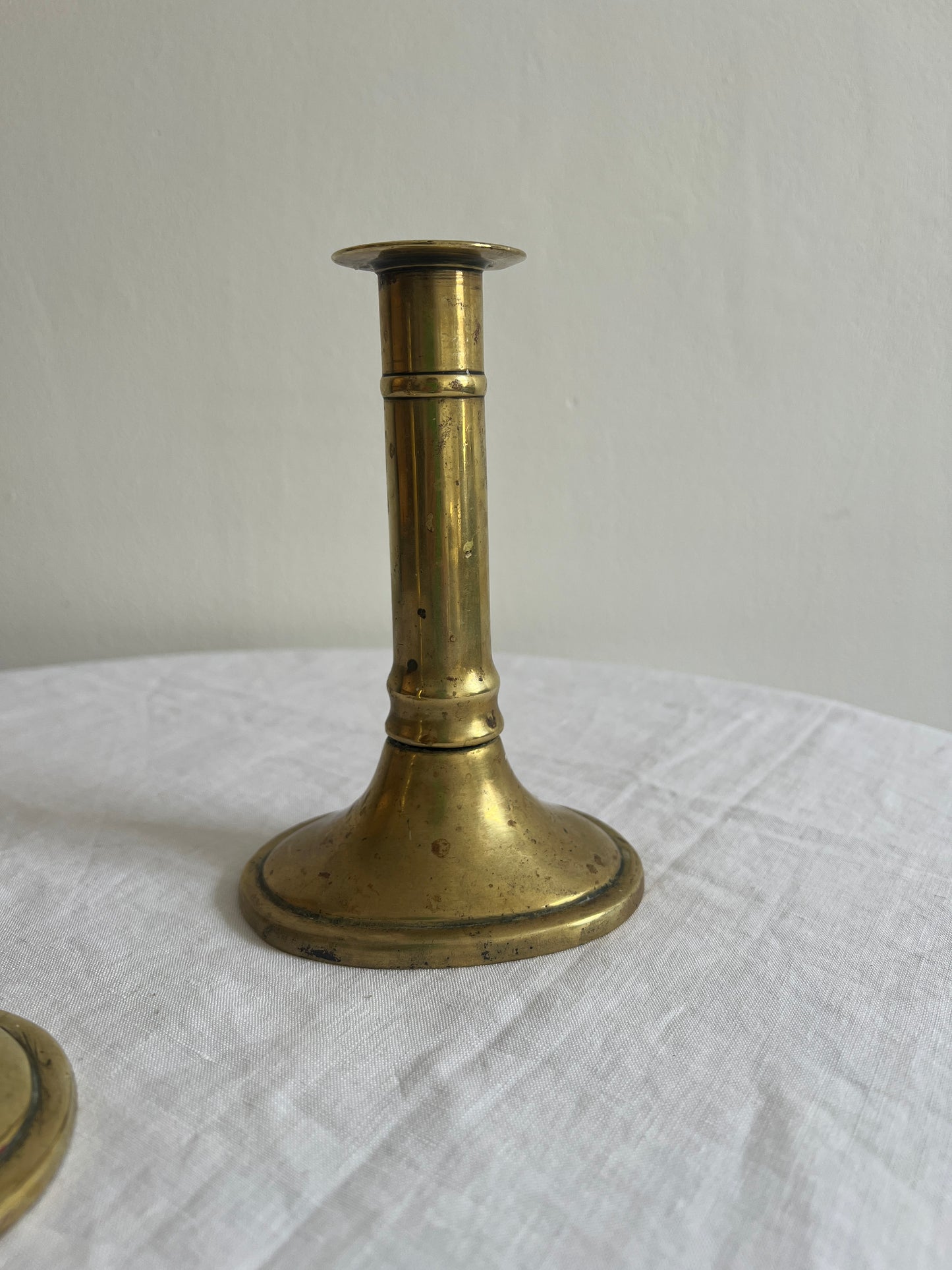 Pair of English polished brass candle sticks