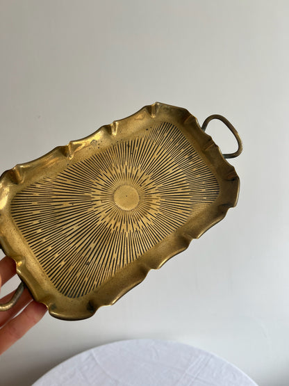 Vintage brass small sunburst tray with a wavy edge and ball feet