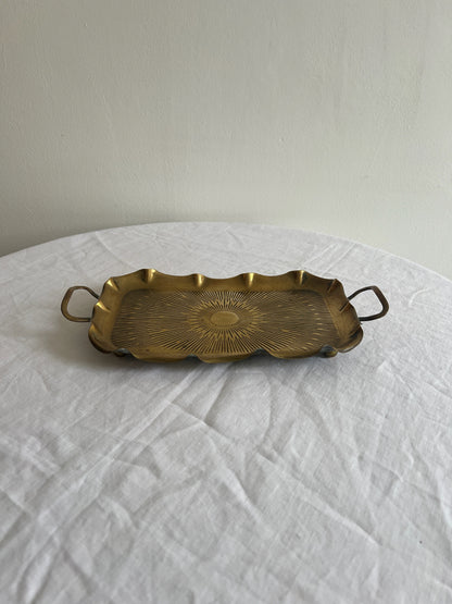 Vintage brass small sunburst tray with a wavy edge and ball feet