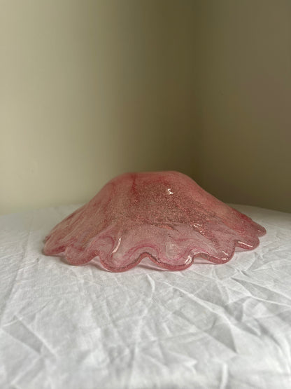Large glass scalloped edge bowl with pink marbling